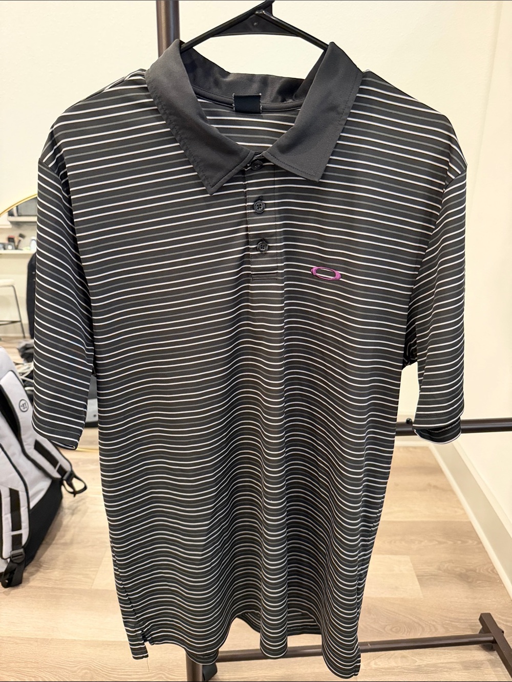 Oakley Black and White Striped Polo with Pink Logo